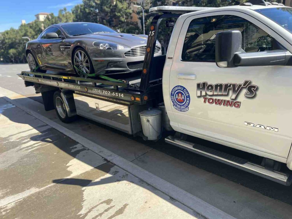 A tow truck with car on Santa Ana road